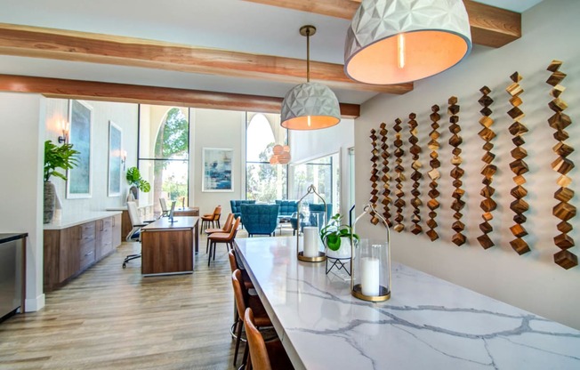 a dining room and living room in a house with a marble counter top  at Veranda La Mesa, California, 91942