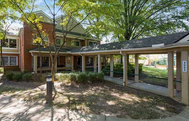 a view of the front porch of a house with a porch swing