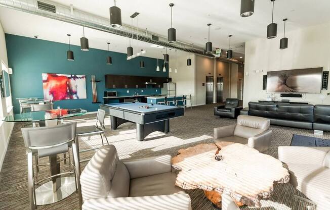 A modern living room with a pool table and a television. at The Platform, Kent, 98032