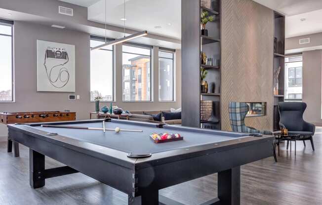 The gallery community space offers both a pool and foosball table all naturally lit with countless windows.