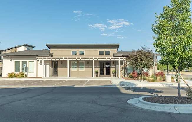 A building with a parking lot in front of it.