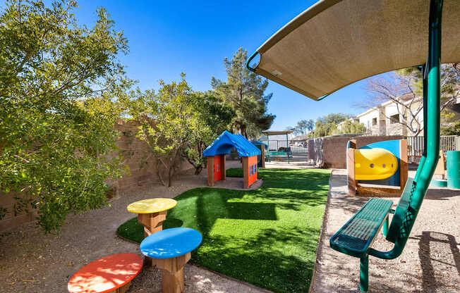 Pet run with exercise equipment and bench at The Fairways by Picerne Apartments, Las Vegas 89141