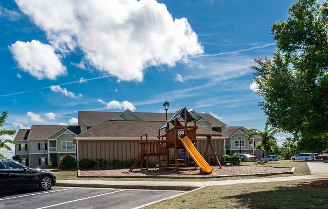 Playground with slide at Riverstone apartments for rent in Macon, GA