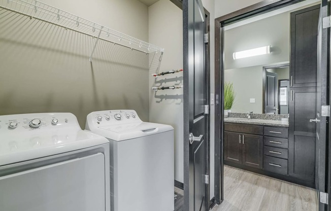 Laundry area and spacious bathroom at WH Flats new luxury apartments in south Lincoln NE 68516