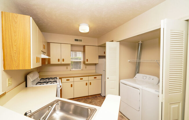 End Style Kitchen with Window at The Highlands Apartments in Elkhart, IN