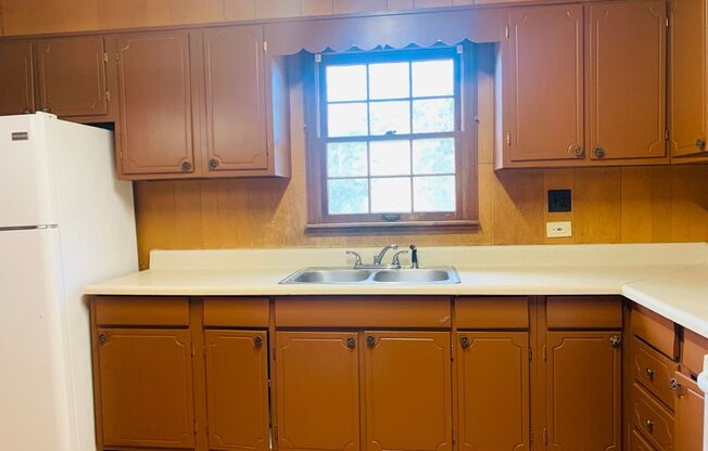 Welcome home! 3 bed, 1.5 bath, newly renovated, brick exterior, carport, hardwood flooring, private lot, must see!