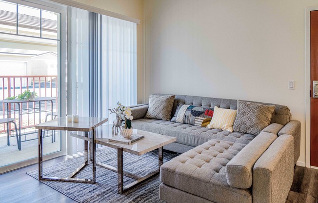 living room with wood like flooring and patio access at Turtle Creek apartments