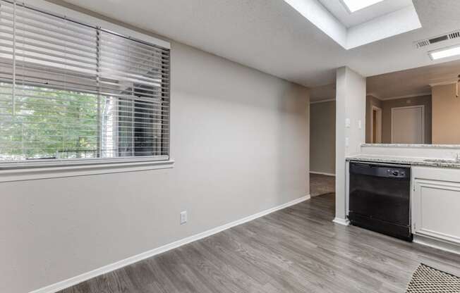 a kitchen and living room with a large window