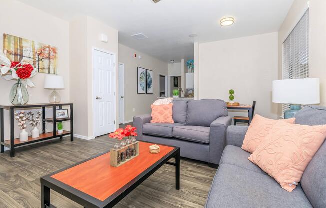 a living room filled with furniture and a flat screen tv