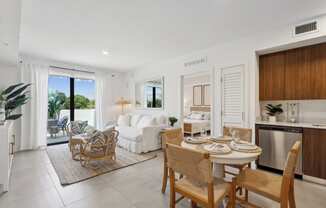 Living Room in B1 Floor Plan with white couch at Westgate on University in Lauderhill, FL