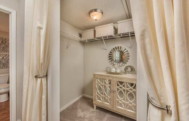 a bathroom with a vanity and a shower and a curtain at Highland Ridge Apartments, Overland Park , 66210