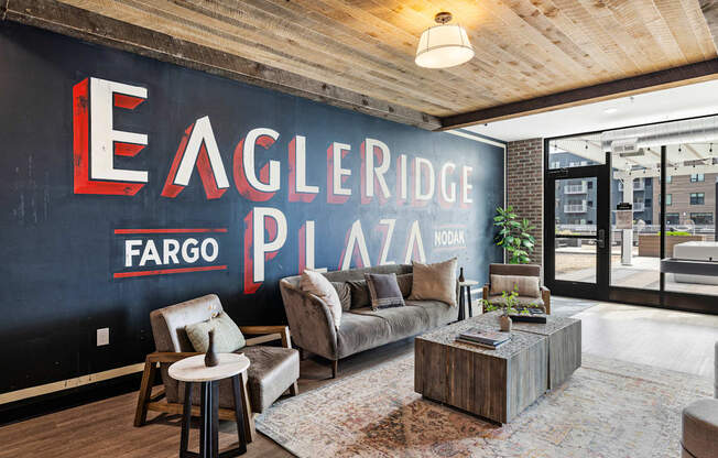 a living room with a large mural on the wall at EagleRidge Plaza Residences, Fargo, ND