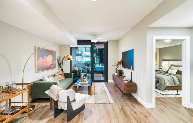 A bright, open living space at Modera McGavock, featuring warm finishes and easy flow, with downtown Nashville just a short drive away.