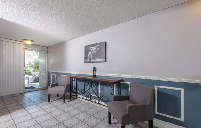 a common area with chairs and a table