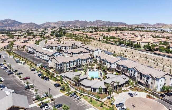 an aerial view of a community with houses and a swimming pool