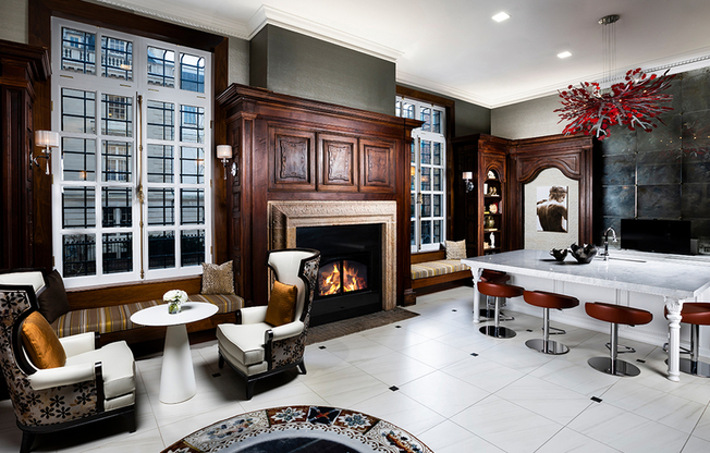 Cozy up in the Biblioteca, a resident lounge complete with fireplaces and historic millwork
