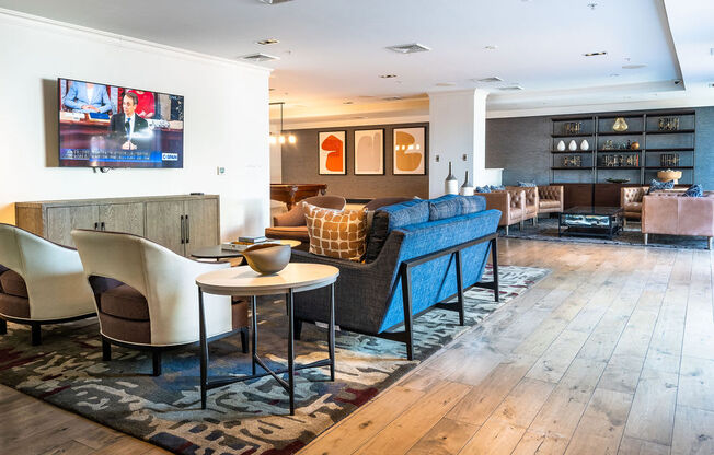 a living room filled with furniture and a tv