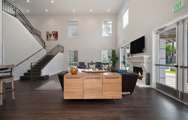A living room with a staircase and a couch.