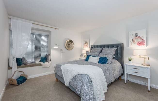 Bedroom with cozy bed at Harpers Point Apartments, Cincinnati, Ohio