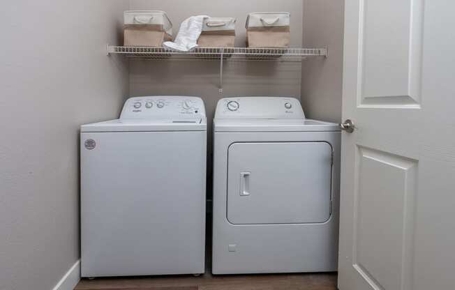 a washer and dryer in a laundry room with a door