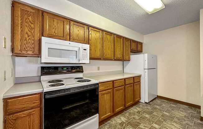 a kitchen with a stove microwave and refrigerator