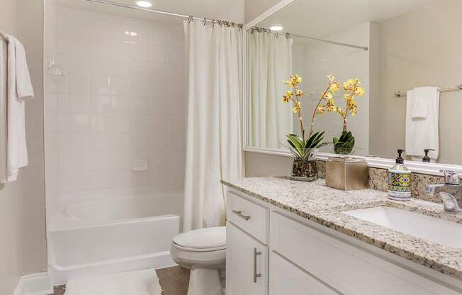 A white bathroom l at Floresta apartments in Jupiter, FL