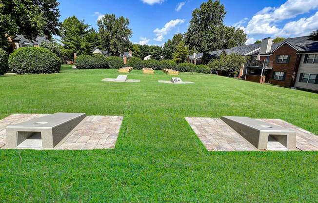 Littlestone Apartments game lawn with cornhole