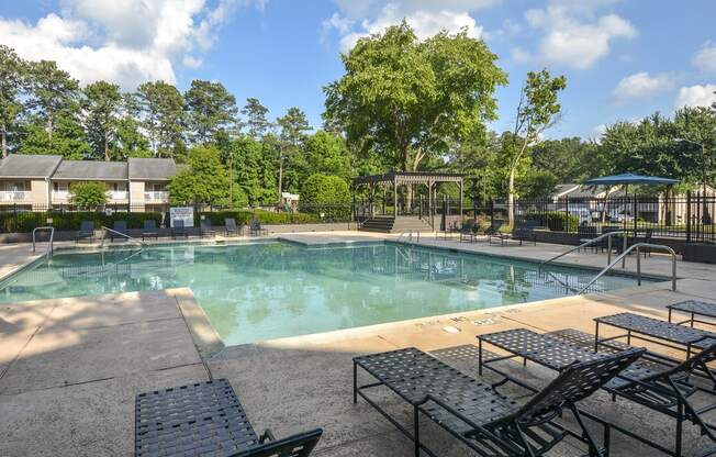 Patio near pool at Harvard Place Apartment Homes by ICER, Lithonia