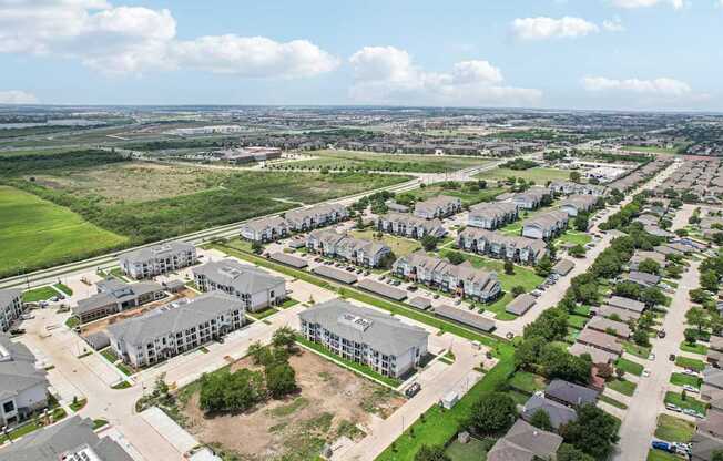 A bird's eye view of a residential area with houses and apartment buildings.
