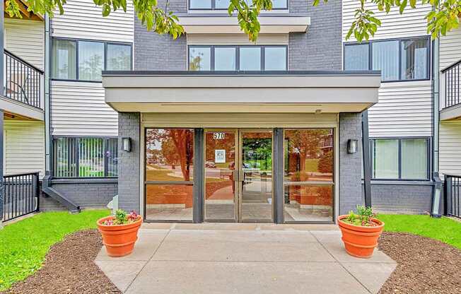 The front of a building with a glass door and windows.