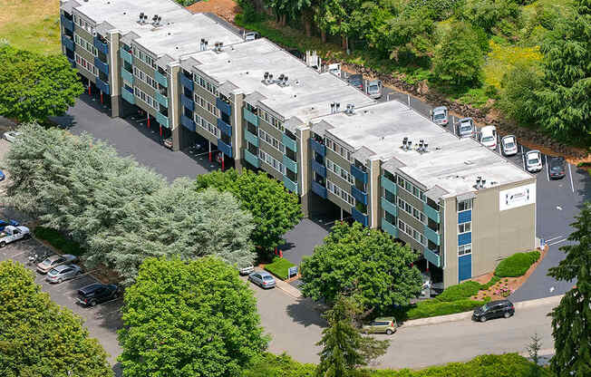 Birds-eye view of Peak 88, surrounded by grass fields and many trees.