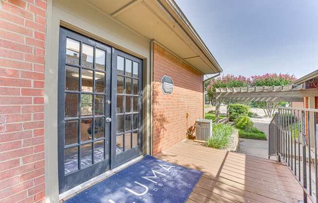 A blue mat with the word at Copper Hill Apartments, Bedford, Texas