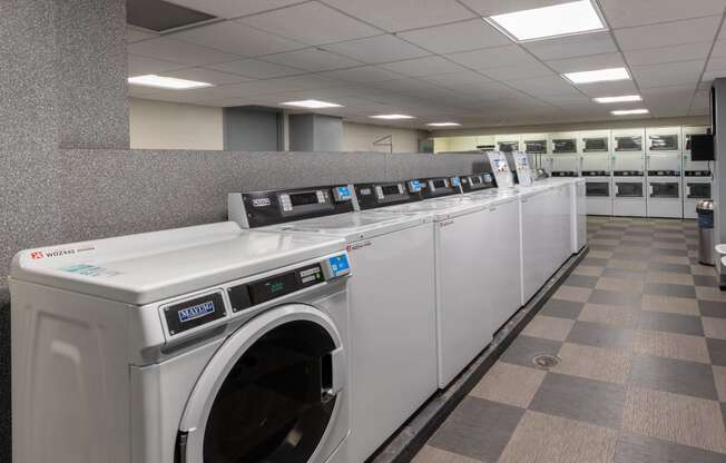 a row of washing machines in a public laundromat