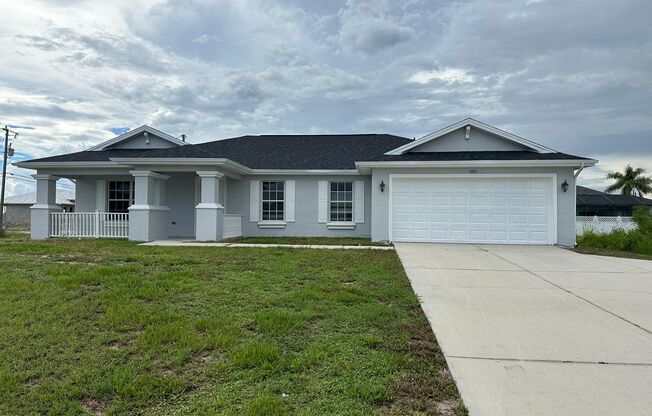 Spacious 3-Bed + Den Home with 2-Car Garage in NE Cape Coral. Special Offer! Qualify for a deposit-free option and save on move-in costs!
