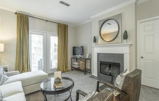 a living room with a couch and a fireplace