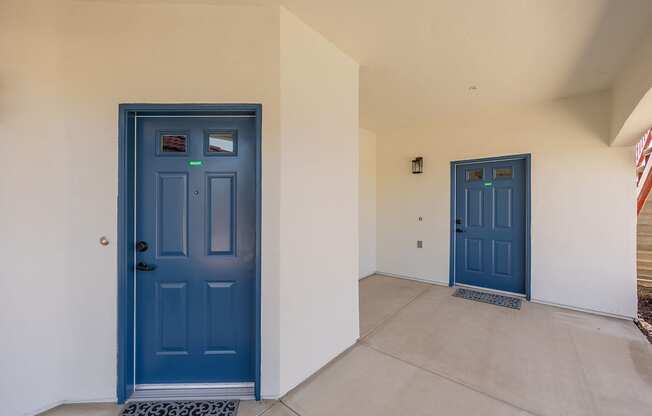 A blue door is on the left and a blue door is on the right.