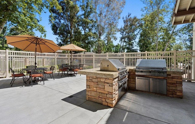 Outdoor BBQ Area with Multiple Grills and Shaded Table Seating at The Meadows at Westlake Village, Westlake Village, 91361