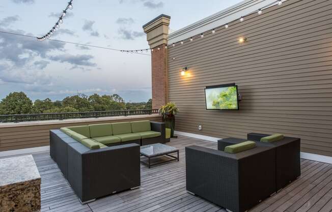 Rooftop patio with seating and outdoor televisions