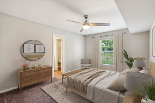 a bedroom with a bed and a ceiling fan