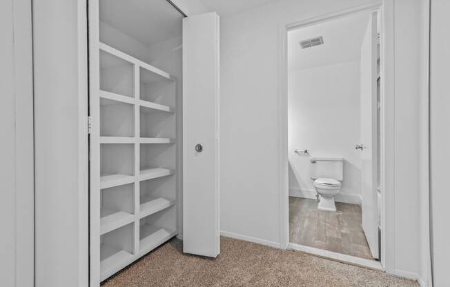 a white bathroom with a white toilet and a white closet at Edge At Farmington Hills - Farmington Hills, MI, Michigan