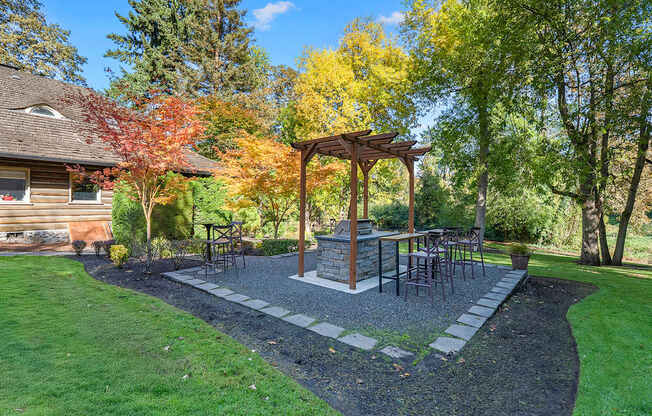 Green area with a bbq station and trees