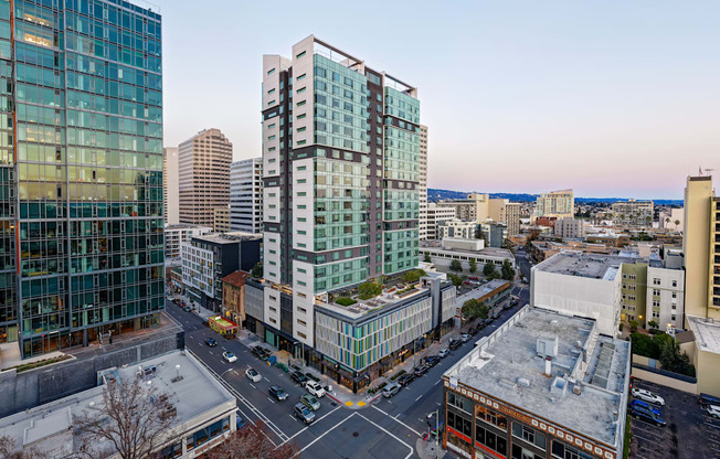 A cityscape with modern buildings and a clear sky.