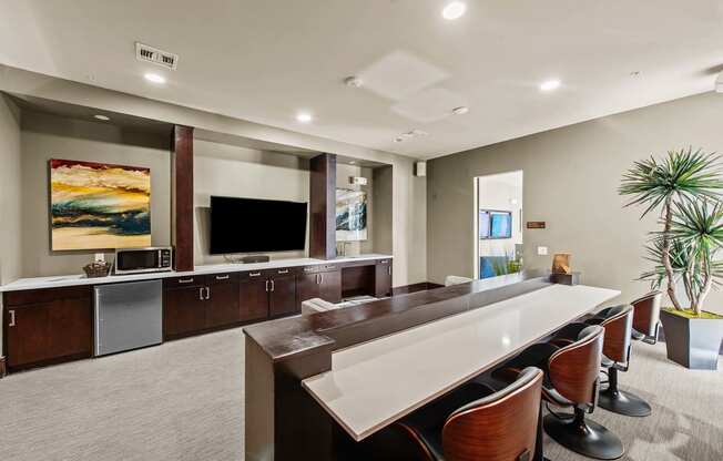 a large kitchen with a long table and chairs