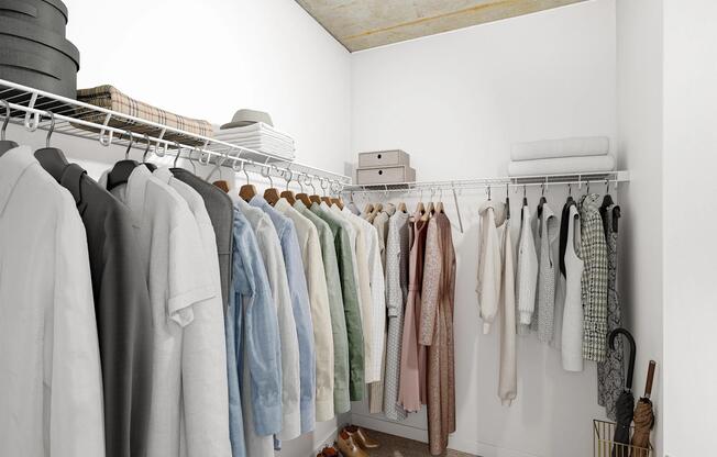 A spacious closet with open shelving and hanging space, providing a simple, organized setup for everyday storage and wardrobe planning.