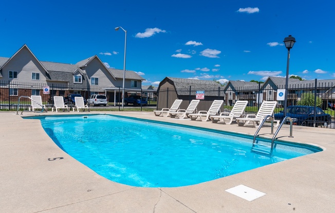 our apartments have a swimming pool with chaise lounge chairs