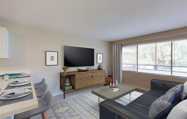 Staged living room with mounted TV, TV stand, coffee table, and large window. at 3030 Lake City, Seattle, WA