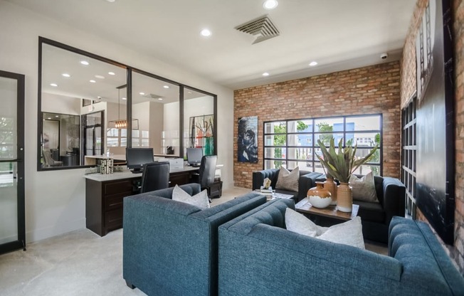 a living room filled with furniture and a large window