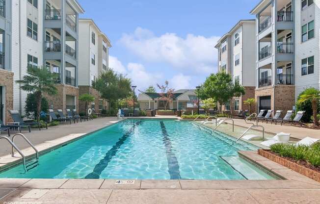 the preserve at ballantyne commons pool with apartment buildings