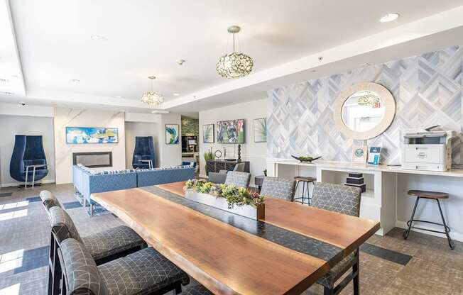 The community lounge at Parkside Commons with a long wooden table and chairs