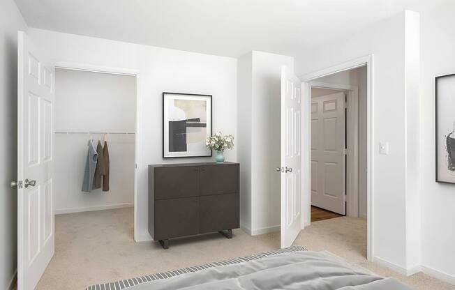 a bedroom with a bed and a dresser and a closet